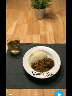 A picture of Pounded Yam with Egusi Soup and Chicken.