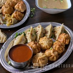 A picture of Steamed & Fried Chicken Momos (Dumplings).