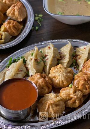 A picture of Steamed & Fried Chicken Momos (Dumplings).