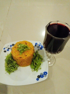 A picture of Rice/beans with salad.