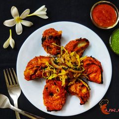 Tandoori Achari Momos A picture of Tandoori Achari Momos.