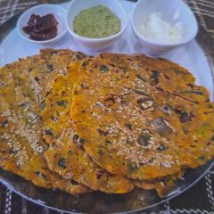 Thecha Thalipith - Mix Flour Flat Bread A picture of Thecha Thalipith - Mix Flour Flat Bread.