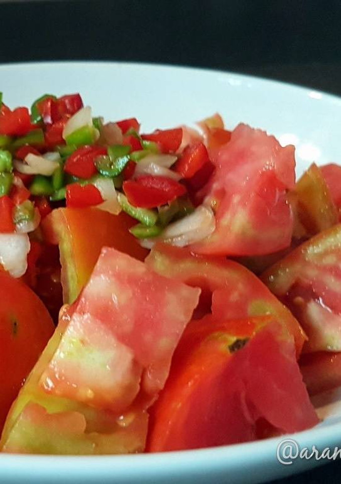 Una foto de Tomate aliñado