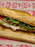 Ciabatta curcuma e semi, Lardo di Colonnata, pomodorini e rucola