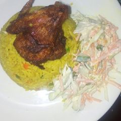 A picture of Fried rice, salad and chicken.