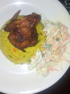 A picture of Fried rice, salad and chicken.