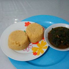 A picture of Vegetable soup with garri.