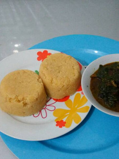A picture of Vegetable soup with garri.