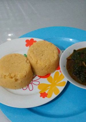 A picture of Vegetable soup with garri.