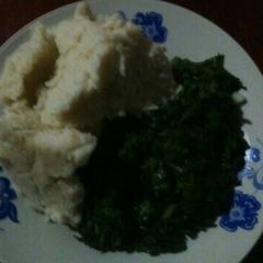 A picture of Ugali with spinach and terere.