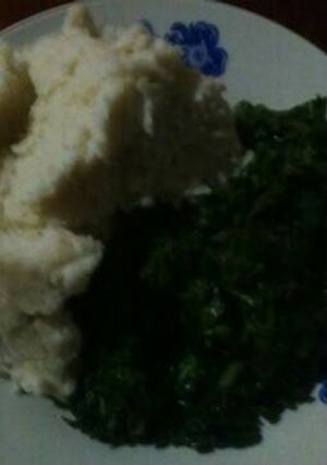 A picture of Ugali with spinach and terere.