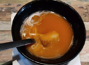 A picture of Carrot & tomato soup with fresh cream.