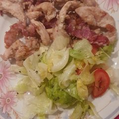 A picture of Chunks of chicken with speck.