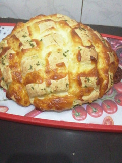 Una foto de Pan agridulce de ajo y queso