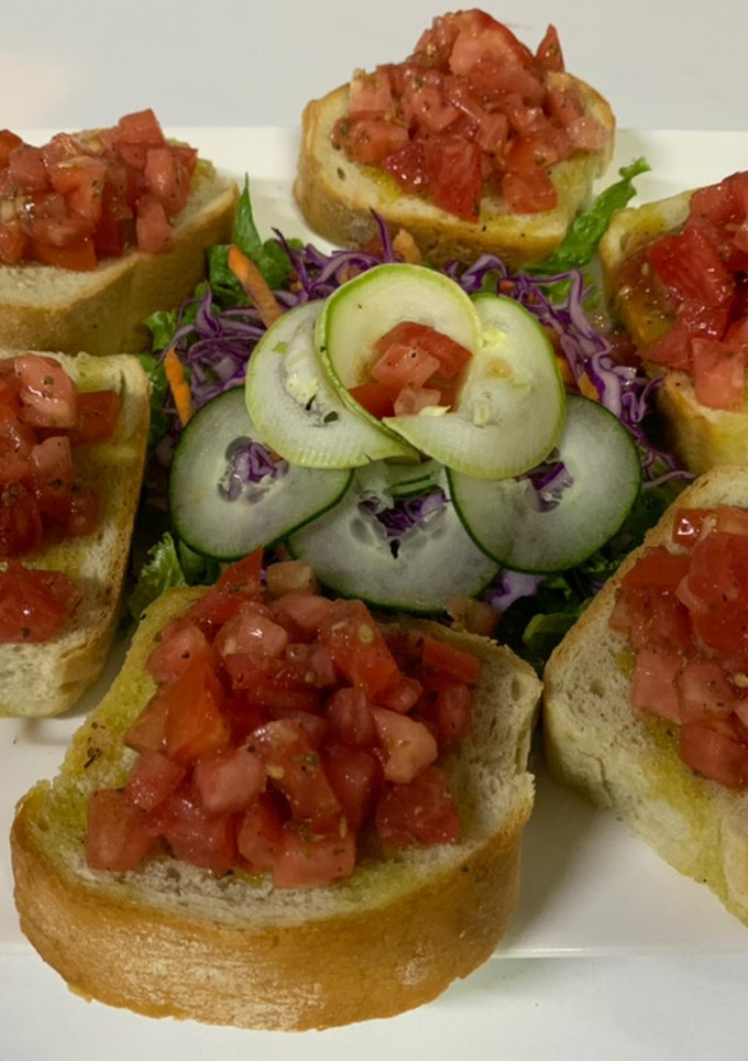 Una foto de Spiedino con pomodoro e origano