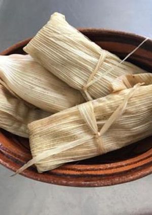 Una foto de Tamales con frijol