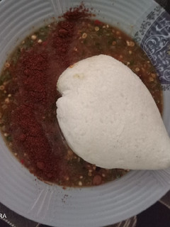 A picture of Tuwon shinkafa with Okro soup.