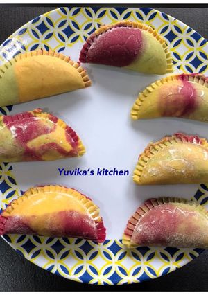 A picture of Three coloured Gujiya.