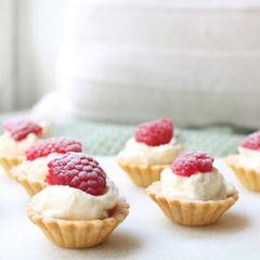 A picture of Lemon Curd Cream filled tart cases with store bought pastry cases.