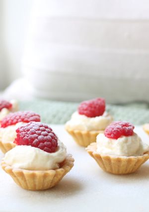 A picture of Lemon Curd Cream filled tart cases with store bought pastry cases.