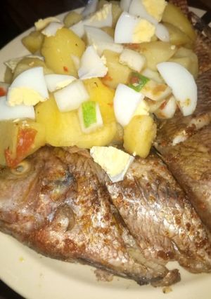 A picture of Grilled 🐠 garnished with Irish and egg.