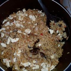 A picture of Brown rice with scramble egg.