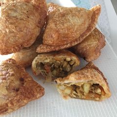 A picture of Airfried Chicken Curry Puffs using Store-bought Pratha Dough.