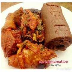 A picture of Chicken with Amala and Efo riro.