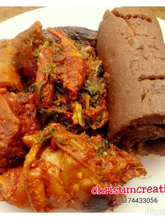 A picture of Chicken with Amala and Efo riro.