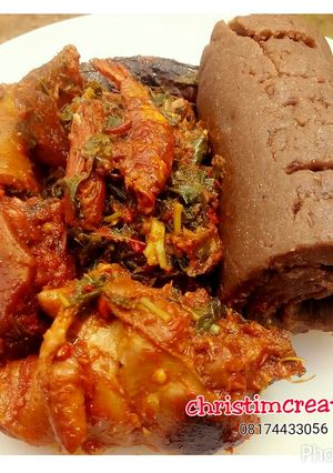 A picture of Chicken with Amala and Efo riro.