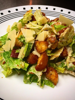 A picture of Caesar Salad, Dressing and Croutons.