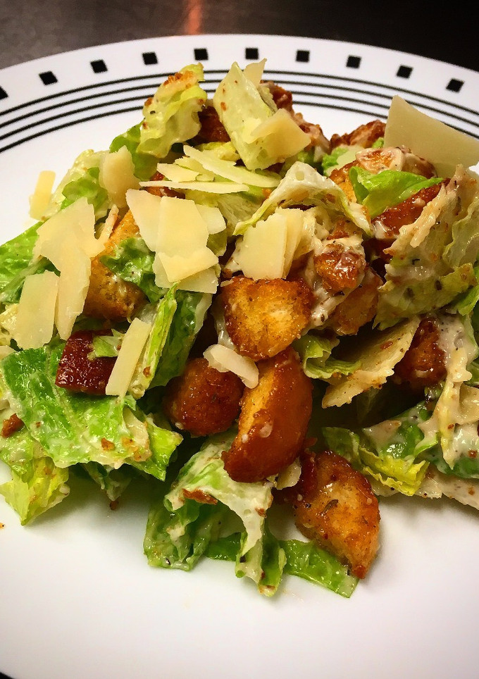 A picture of Caesar Salad, Dressing and Croutons.