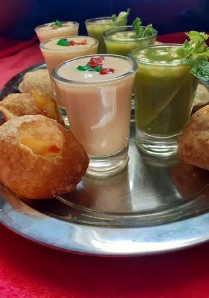 A picture of Mango stuffing with mango panipuri shots.