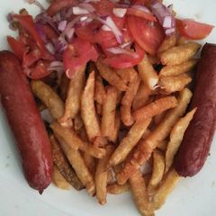 A picture of Fries with choma sausages.
