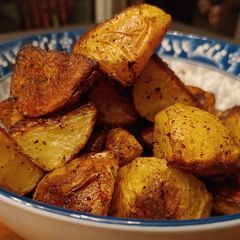 A picture of Crispy herby roasted potatoes.