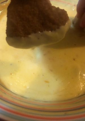 Una foto de Salsa de cheddar suave para papas o patitas