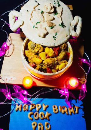 A picture of Chicken stew in edible pot.