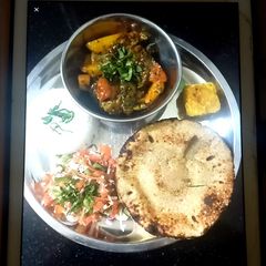 A picture of Brinjal potatoes sabzi (eggplant).
