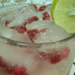 Lemon water with pomegranate icecubes A picture of Lemon water with pomegranate icecubes.