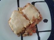Una foto de polenta gratinada