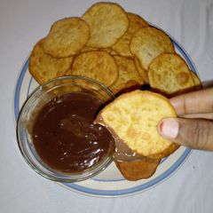 Milk crackers with chocolate sauce A picture of Milk crackers with chocolate sauce.