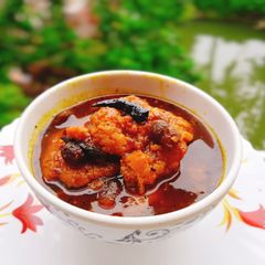 A picture of Fish egg fritters in tamarind chutney.