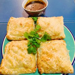 A picture of Lumpia PanggangSaos AsamManis🇲🇨Lumpia Pie wSweet 'n Sour Sauce.