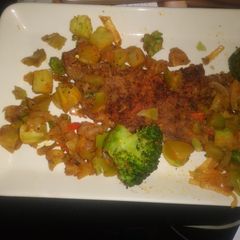 A picture of New York Steak-Onions With Broccoli.