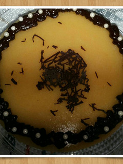 Una foto de Mousse de queso y cobertura de mango