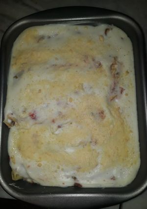 Una foto de Canelones de espinaca y ricota con salsa de tomate natural