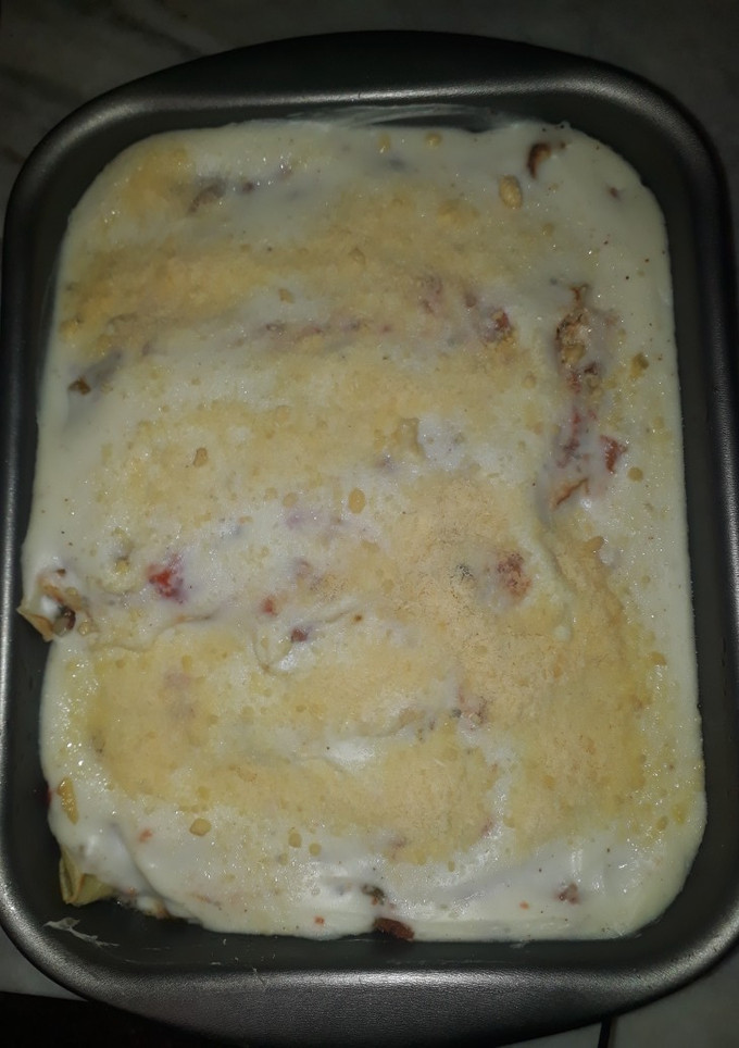 Una foto de Canelones de espinaca y ricota con salsa de tomate natural