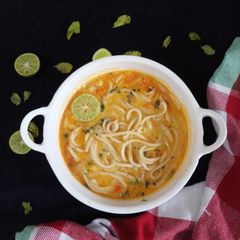 A picture of Thai noodle soup with desi tadka.