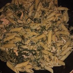 A picture of Penne with salmon spinach and courgette.