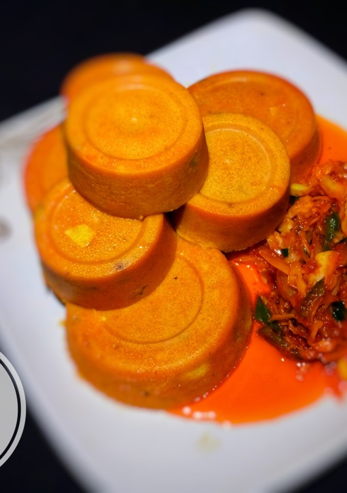 A picture of Moi - moi with cabbage sauce.